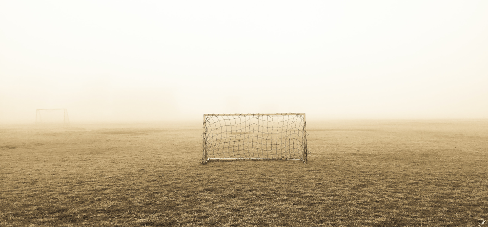 Soccer net in field, dysfunctional goal culture